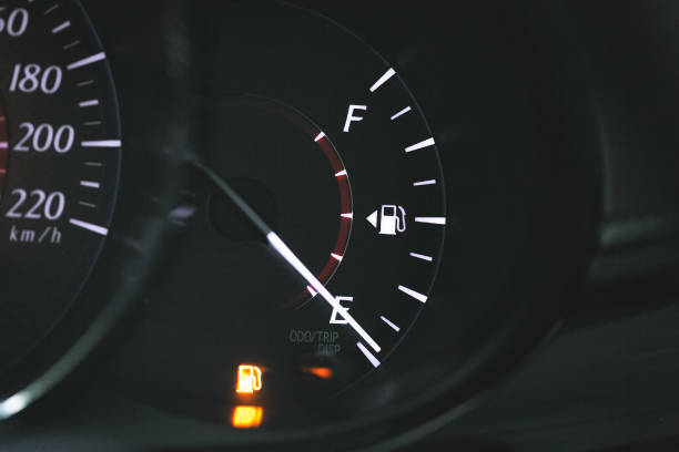Low Fuel gauge showing fuel dashboard. stock photo