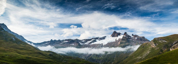 Low lying clouds at La Ville Des Glaciers stock photo