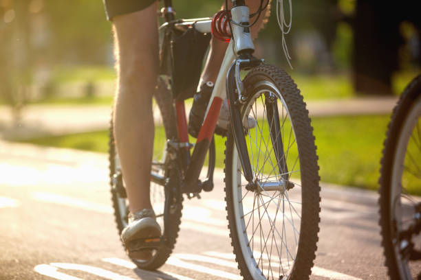 Low section of man riding a bicycle stock photo