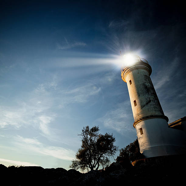 Low-angle view of a lighthouse at twilight stock photo