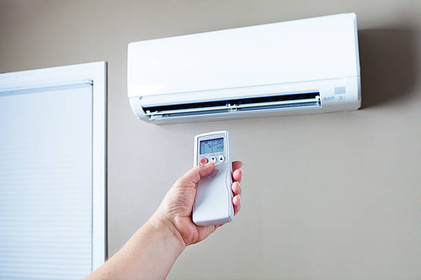 Lowering and Turning Off Air Conditioning to Conserve Eletricity Energy stock photo