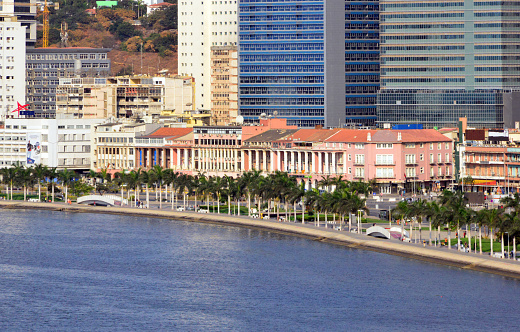 Luanda, Angola: the corniche - panorama of the waterfront avenue, Avenida Marginal / 4 de Fevereiro - colonial architecture survives under the shadow of the modern high-rise buildings - Luanda Bay, Atlantic Ocean - Ingombota (multiple small logos, compatible with Getty guidelines, article 1736)