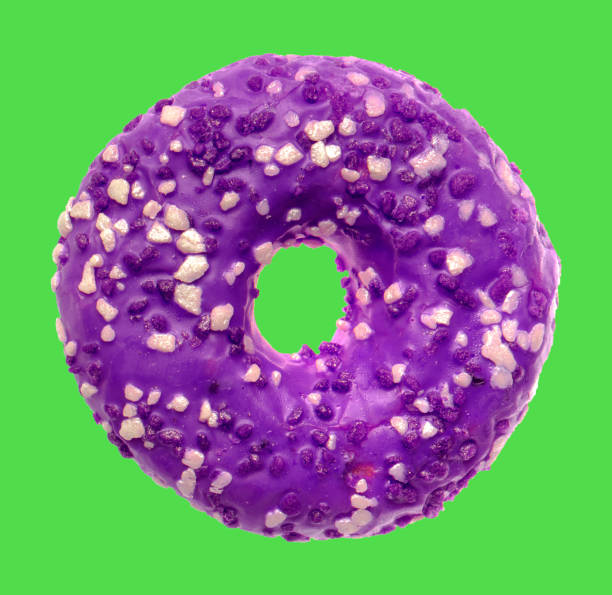 lush donut covered with cream, on a green background stock photo