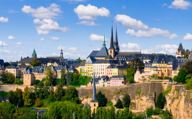 Luxembourg Old Town View of the Luxembourg Old Town with the towers of the Notre Dame Cathedral under a nicely clouded sky luxembourg benelux stock pictures, royalty-free photos & images