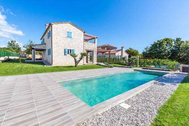 Luxurious beautiful modern villa with swimming pool and yard garden Luxurious beautiful modern villa with swimming pool and yard garden, Istria, Croatia stone house stock pictures, royalty-free photos & images