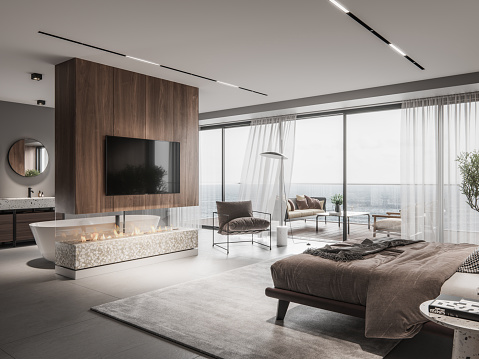 Interior of a bedroom with fireplace and tv on wall. 3D rendering of a luxurious master bedroom interior with large windows.