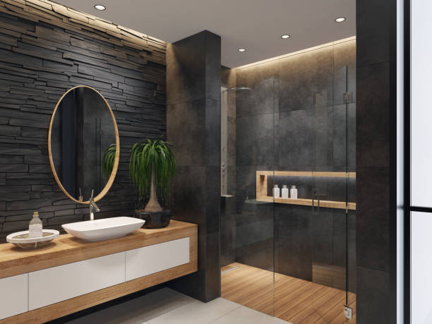 Luxurious minimalist bathroom with slate black stone wall stock photo