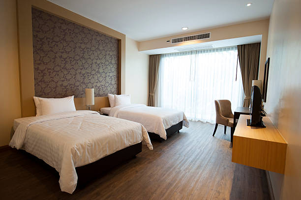 Luxurious two bed hotel room with hardwood floors stock photo