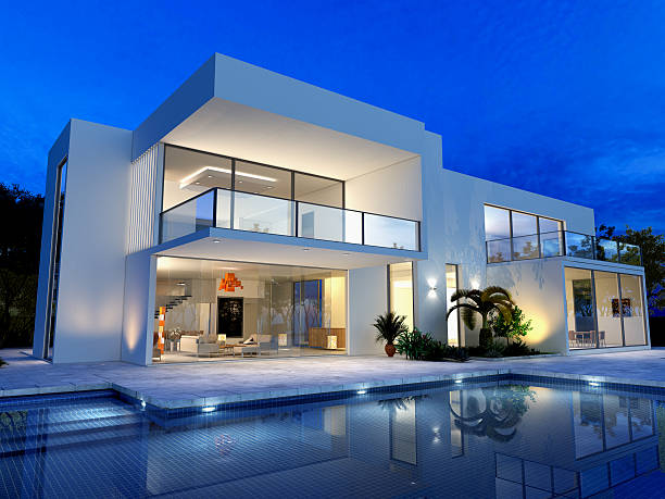 Luxurious villa with pool luxurious villa with swimming pool at dusk mansion stock pictures, royalty-free photos & images