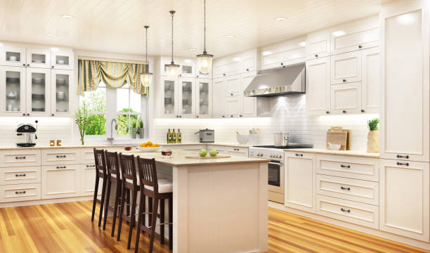 Luxurious white kitchen in a large beautiful house Luxurious white kitchen in a beautiful house camiseta barata stock pictures, royalty-free photos & images