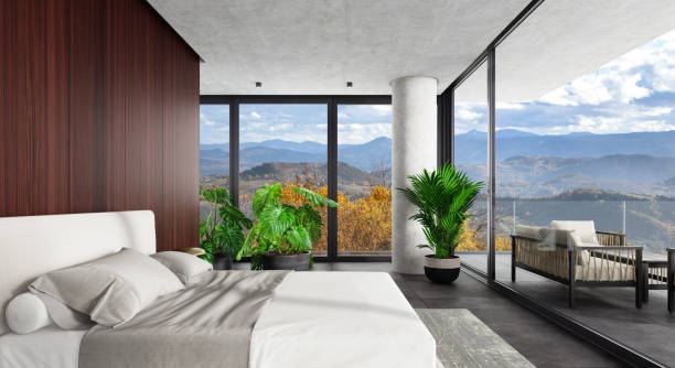 Luxury Hotel Modern interior bedroom with large windows. Autumn scene hill country side. stock photo