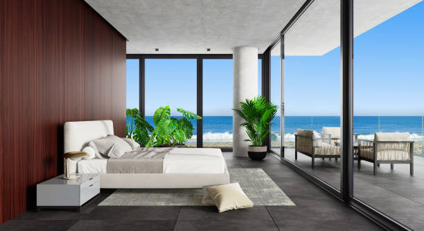 Luxury Hotel Modern interior bedroom with large windows. Summer scene ocean side. stock photo