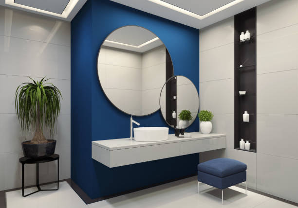 Luxury minimalist bathroom with royal blue wall and large white tiles stock photo