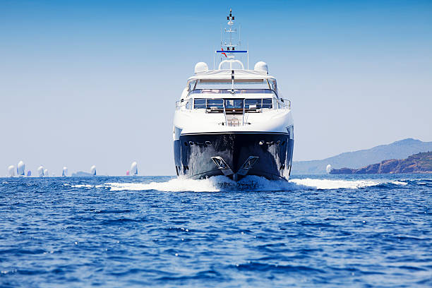 A luxury motor yacht cruising the ocean stock photo