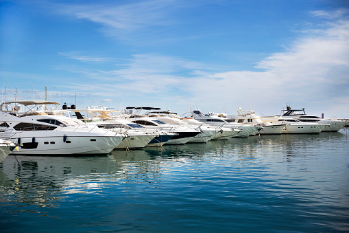 Luxury yachts docked in Puerto Banus, the marina of Marbella. Famous and Luxury location in Costa del Sol , Spain