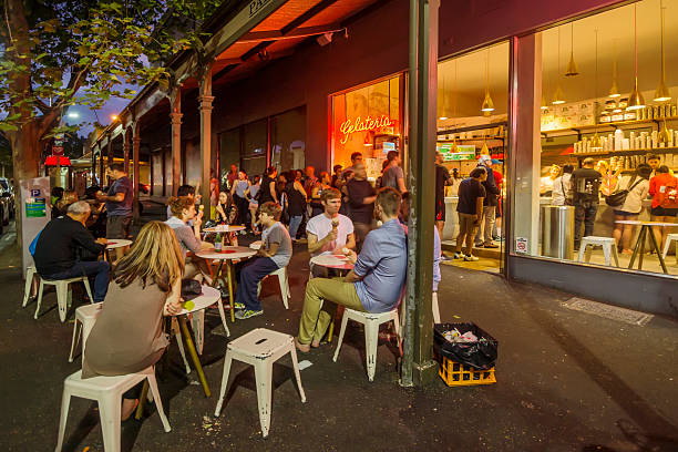 Lygon Street - Pidapipo Gelateria Melbourne, Australia - October 10, 2015: Customers eating and queueing outside Pidapipo Gelateria on Lygon St on a Saturday night. melbourne street stock pictures, royalty-free photos & images
