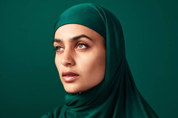 I'm in hijab and proud of it! Cropped shot of a beautiful young woman wearing a headscarf against a green background beautiful arab woman stock pictures, royalty-free photos & images