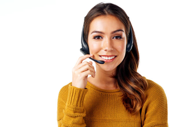 I'm patiently waiting on your call Cropped shot of a call center agent posing against a white background headset woman customer service stock pictures, royalty-free photos & images