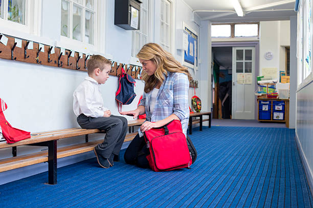 I'm very disappointed with you Young mother scolding her son in the corridor for bad behaviour in nursery. child behaving badly stock pictures, royalty-free photos & images
