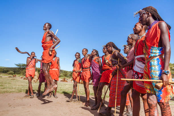 Maasai warriors Masai Mara, Kenya, May 23, 2017: Masai warriors in traditional costume jumping during a ritual. masai warrior stock pictures, royalty-free photos & images