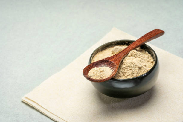 maca root powder in a bowl stock photo