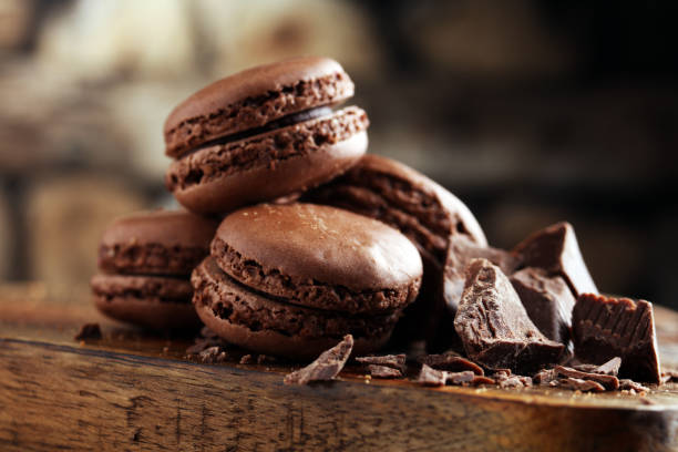 macarons sweet chocolate macaron French on wooden table stock photo