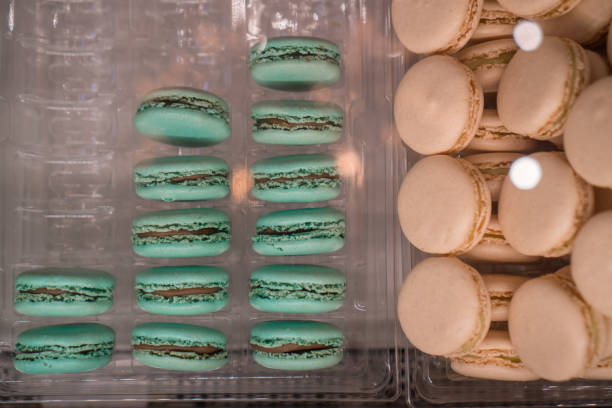 macaroons displayed in a case stock photo