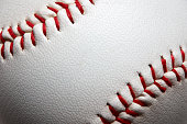 istock Macro close-up baseball ball with stiches and seam 1355976252