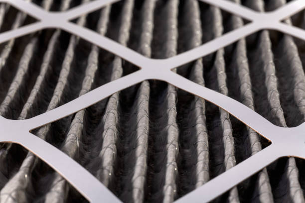 Macro of Dirty Air Filter Close up of home air filter showing the dirt and particle cause bacteria inflection and sickness. filtration stock pictures, royalty-free photos & images