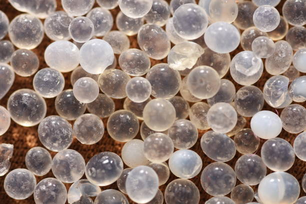macro of silica gel balls macro of silica gel balls gel pack stock pictures, royalty-free photos & images