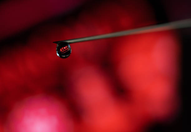 A macro shot of a syringe contain vaccine for corona virus covid19 stock photo