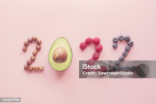 istock 2022 made from healthy food on pink background, Happy New year, health diet resolution, goals and lifestyle 1345411196