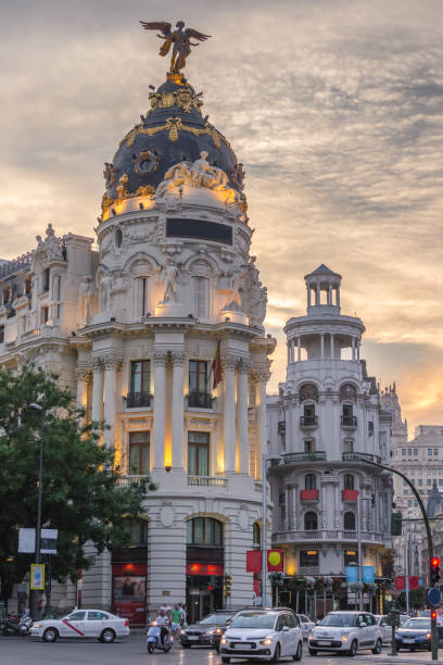 Madrid downtown in gran via main shopping street with traffic light during twilight sunset,Spain. stock photo