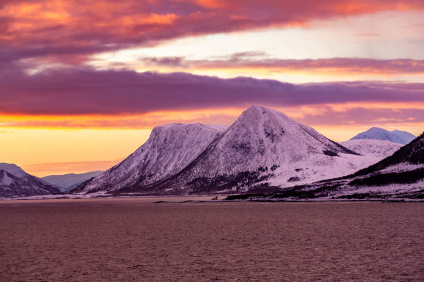 Magic Atmosphere, Dramatic Sky with Land and Sea, Norwegian Winter at Dawn stock photo