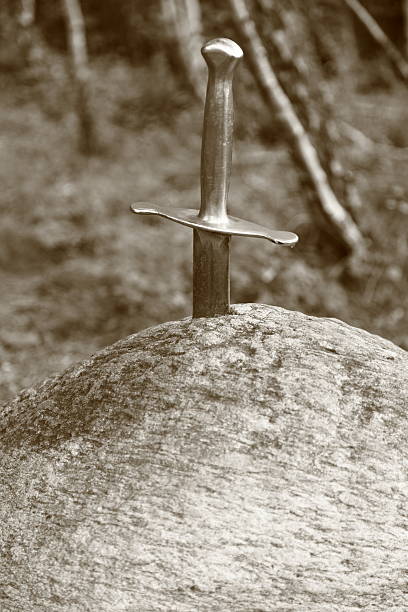 Magic Sword in a rock stock photo