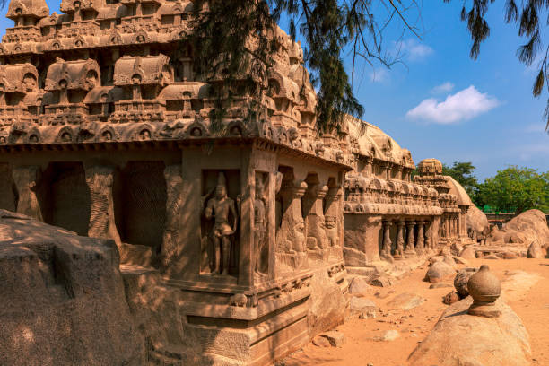 Mahabalipuram, India: Four Of The Five Pallava 7th Century Rathas Each Sculpted Out Of A Single Granite Rock, Lined Up In This Shot stock photo