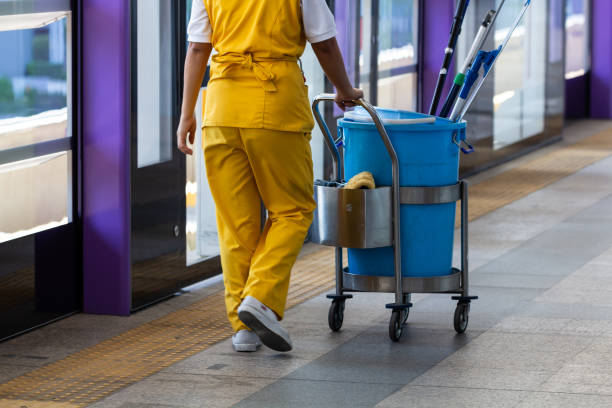 maid working with janitorial mop bucket car.  cleaner stock pictures, royalty-free photos & images