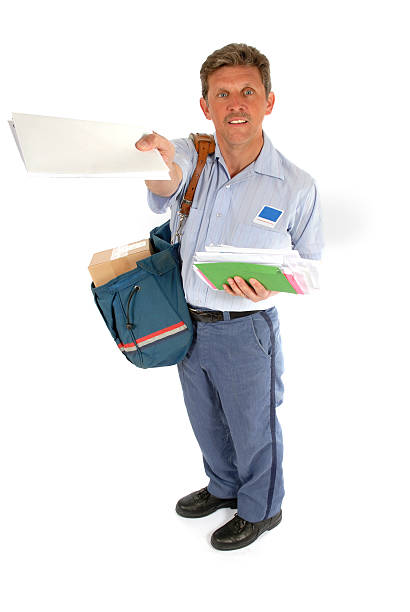 Mailman offering mail to a customer stock photo