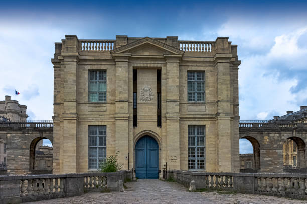 Main entrance to Chateau de Vincennes - massive 14th and 17th century French royal fortress in the town of Vincennes, Val-de-Marne, France Vincennes, Val-de-Marne, France - May 26, 2019: Main entrance to Chateau de Vincennes - massive 14th and 17th century French royal fortress blue front main door stock pictures, royalty-free photos & images