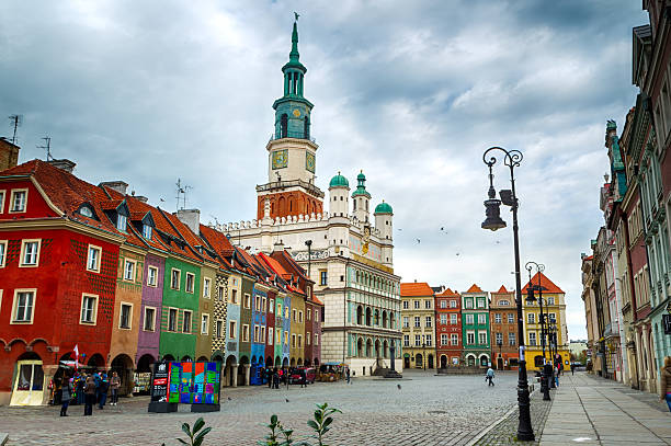 Main square and town hall in Poznan, Poland. Poznan, Poland - November 04, 2012: The colorful main square and town hall in Poznan, Poland. The city is the 4th largest and the 3rd most visited city in Poland. poznan stock pictures, royalty-free photos & images