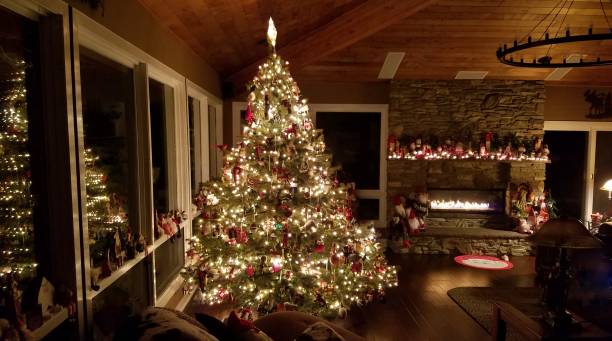 Majestic Holiday Christmas Tree in a Large Log Cabin Rustic Setting stock photo