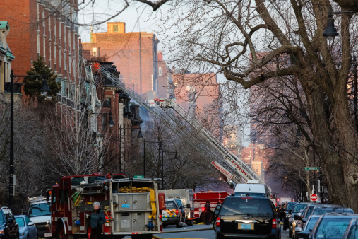 Boston, Massachusetts, United States - March 26, 2014: Boston Fire Department responds to a 9 alarm file near Fairfield St. and Beacon Street. 2 firefighters reportedly died from that blaze. Photo was shot during the afternoon of March 26, 2014.