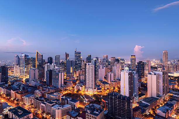 Makati skyline (Manila - Philippines) Elevated, night view of Makati, the business district of Metro Manila. philippines stock pictures, royalty-free photos & images