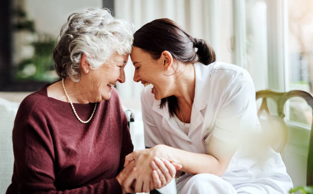 Make a difference in someone's life by making them smile Cropped shot of seniors enjoying life in a retirement home consoling photos stock pictures, royalty-free photos & images