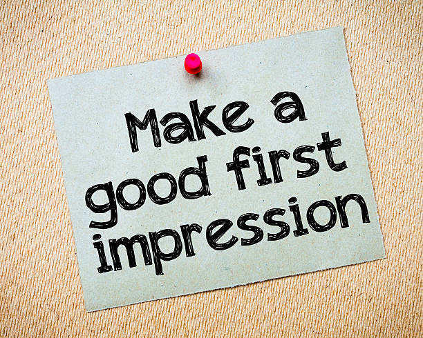 Make a first good impression Make a first good impression Message. Recycled paper note pinned on cork board. Concept Image first impression stock pictures, royalty-free photos & images