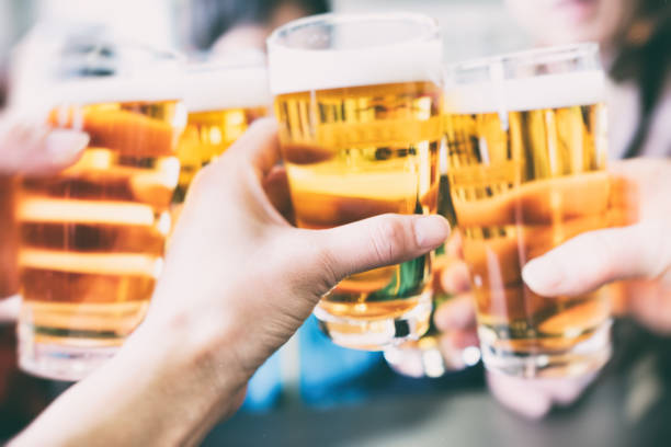 Make a toast with a beer stock photo