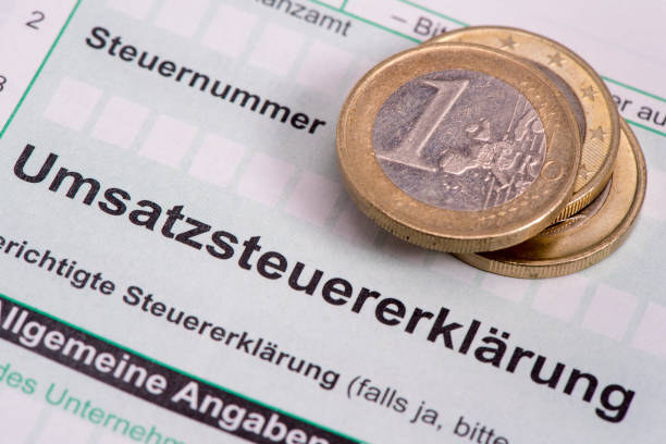 Make filling in German tax form for sales tax VAT stock photo