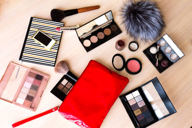 makeup maquillage kit (set): palette, brush, eye shadow, powder, lipstick (flat lay) stock photo