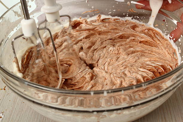 Making Chocolate Hazelnut Meringue Cake stock photo