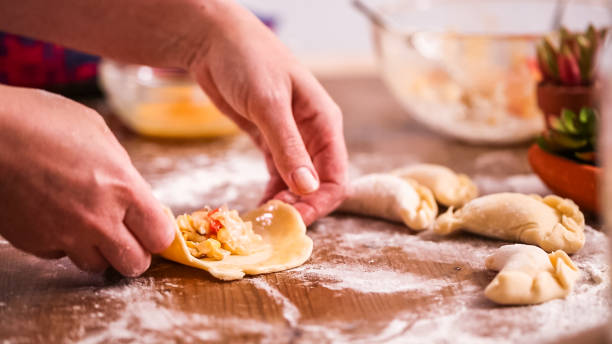 Making home made empanadas with different fillings. stock photo